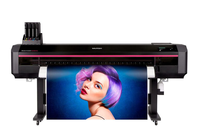 An image of a wide-format printer manufactured by Mutoh featuring a black body, a red stripe across the front, and a mock up of a graphic coming out of the printer with a blue background and a woman with short purple hair looking over her shoulder into the camera